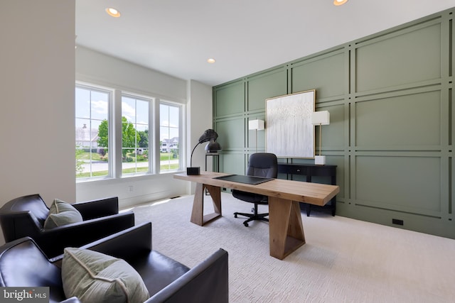 office area featuring recessed lighting, carpet flooring, and a decorative wall