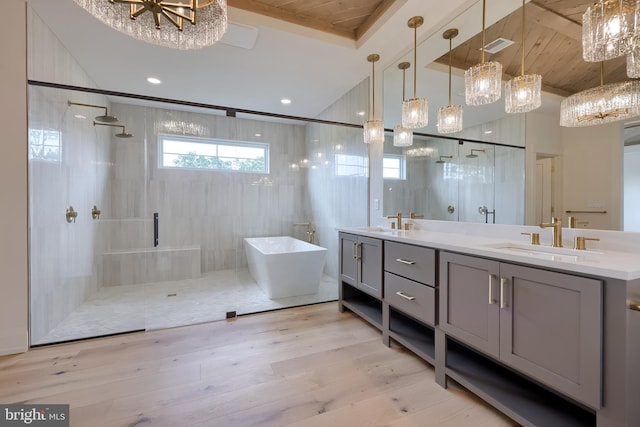 11 Sailfish Dr, Mechanicsburg, PA 17050 - bathroom featuring a chandelier, wooden ceiling, a freestanding bath, double vanity, and a stall shower