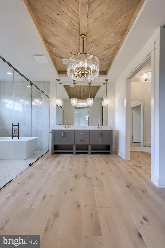 11 Sailfish Dr, Mechanicsburg, PA 17050 - bathroom with a chandelier, wood-type flooring, double vanity, a soaking tub, and wood ceiling