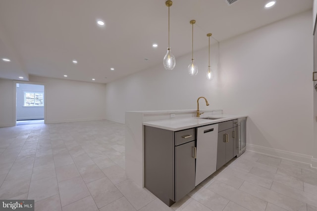 11 Sailfish Dr, Mechanicsburg, PA 17050 - kitchen with white dishwasher, gray cabinets, recessed lighting, light tile patterned floors, and light countertops