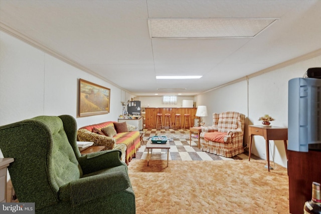 living room featuring crown molding and tile patterned floors