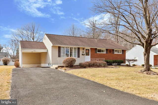 ranch-style house with aphalt driveway, brick siding, a shingled roof, and a front lawn