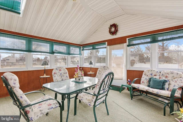 sunroom / solarium featuring lofted ceiling