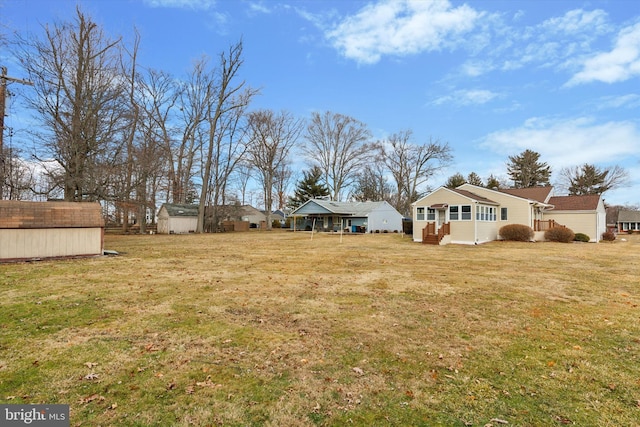 view of yard with an outbuilding and a storage shed