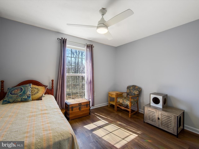 bedroom featuring dark wood-style floors, baseboards, and a ceiling fan