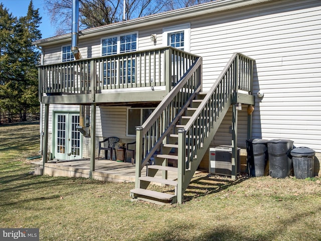 back of house featuring central air condition unit, stairs, a yard, french doors, and a wooden deck