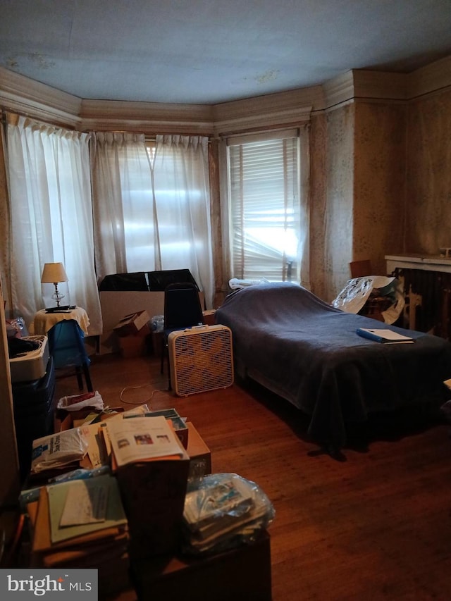 bedroom with wood finished floors