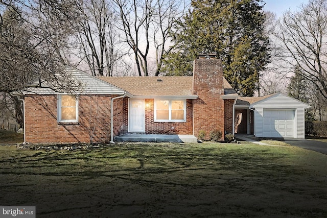 ranch-style house with a garage, driveway, brick siding, and a chimney