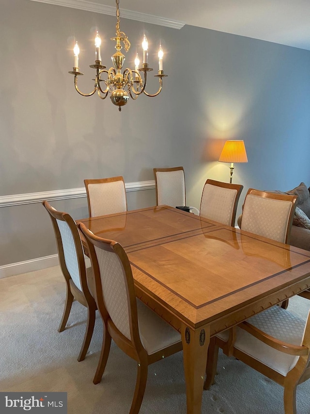 dining space with light carpet, baseboards, and an inviting chandelier