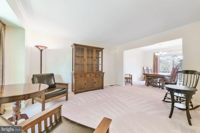 living area with light carpet, baseboards, a chandelier, and crown molding