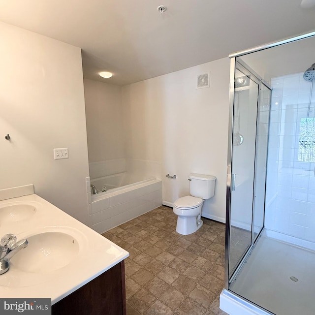 bathroom featuring a bath, a sink, visible vents, and a shower stall