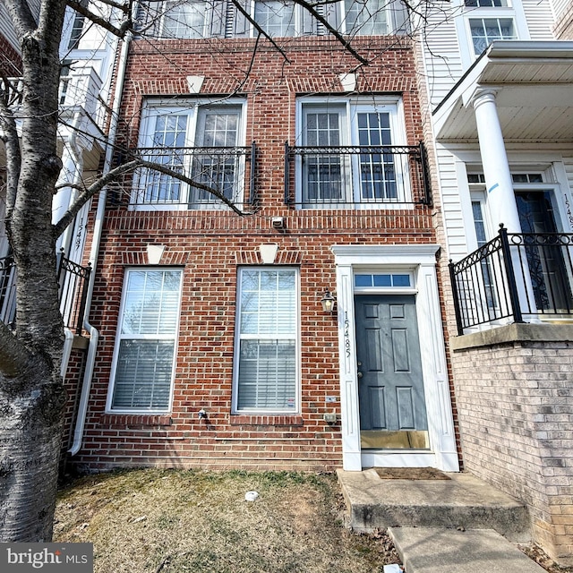 exterior space featuring brick siding