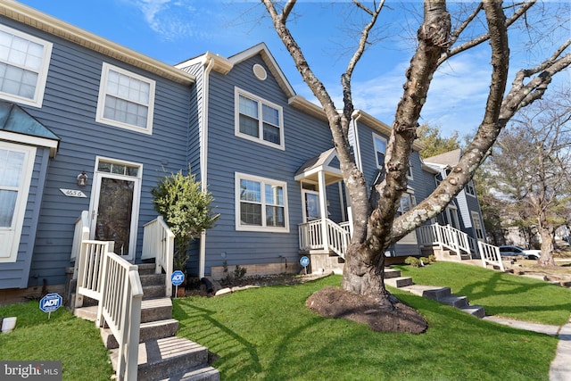 view of front of property with a front lawn