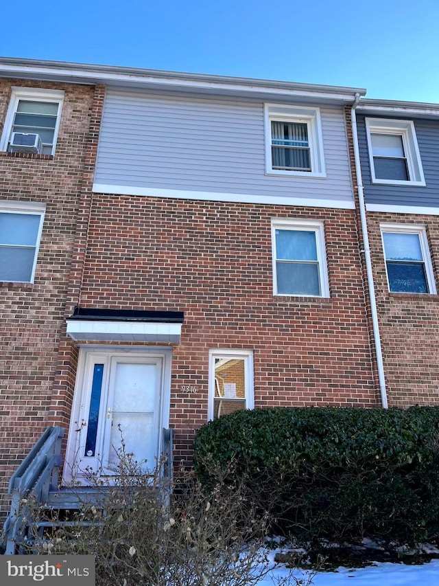 exterior space featuring brick siding