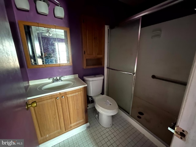 full bathroom with toilet, a stall shower, and vanity