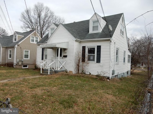 cape cod house with a front lawn