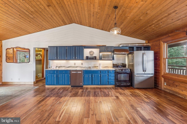 kitchen with lofted ceiling, appliances with stainless steel finishes, blue cabinetry, and dark wood-style floors