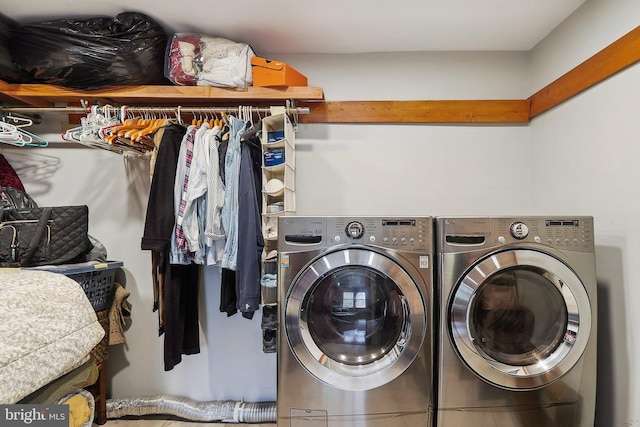 clothes washing area featuring laundry area and washing machine and dryer