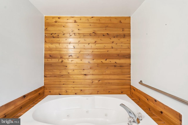 bathroom featuring a tub with jets