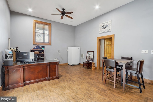 office area featuring a ceiling fan, recessed lighting, light wood-style flooring, and baseboards