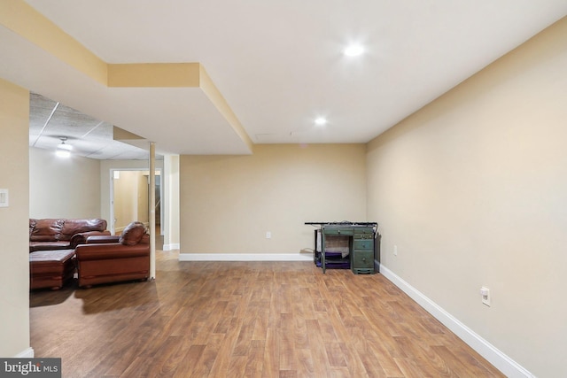 interior space with baseboards and wood finished floors