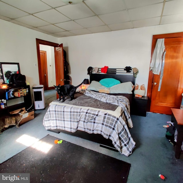 bedroom with a drop ceiling