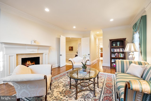 1221 Mottrom Dr, Mclean, VA 22101 - living area featuring wood finished floors, recessed lighting, ornamental molding, and a warm lit fireplace