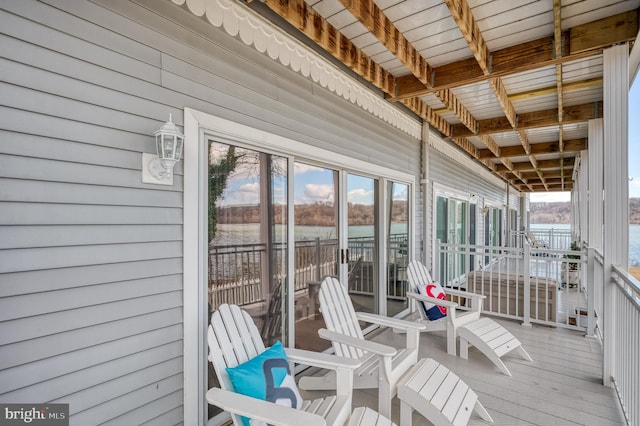 unfurnished sunroom with a water view and plenty of natural light