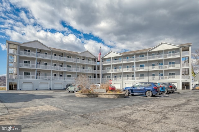 view of property featuring uncovered parking