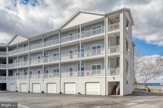 view of building exterior with a garage and driveway