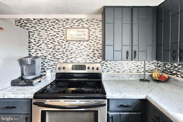 kitchen featuring light countertops, tasteful backsplash, stainless steel range with electric stovetop, and gray cabinetry