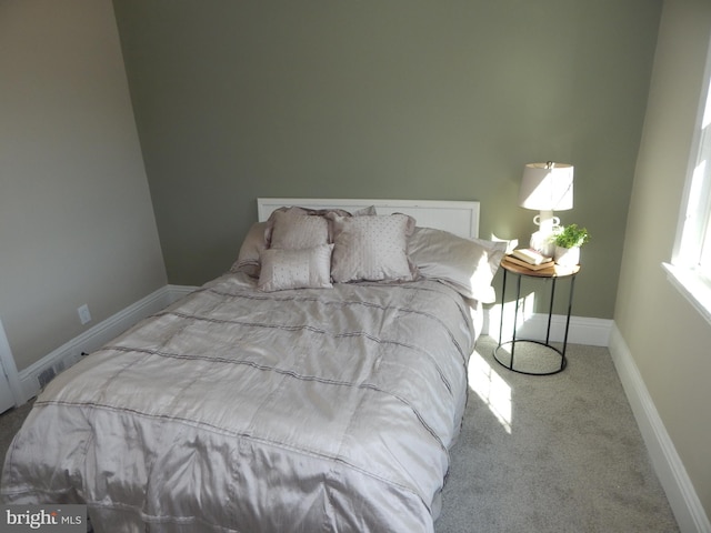 bedroom featuring carpet floors and baseboards