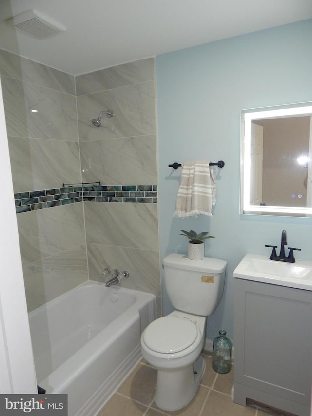 full bathroom featuring bathtub / shower combination, toilet, visible vents, vanity, and tile patterned floors