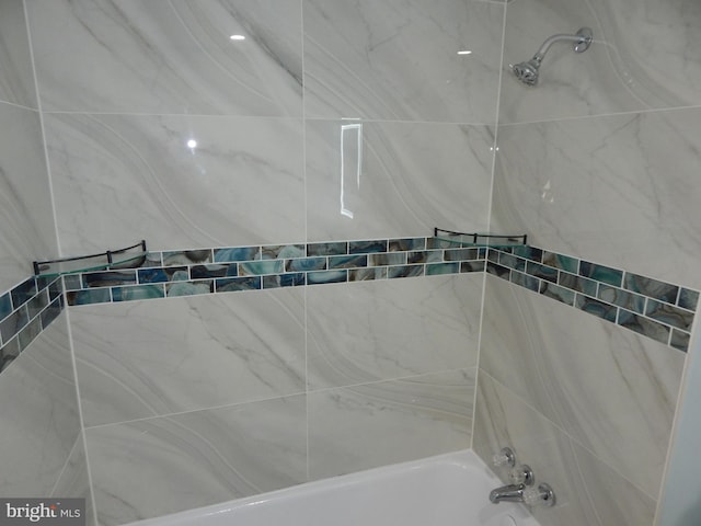 bathroom with shower / tub combination