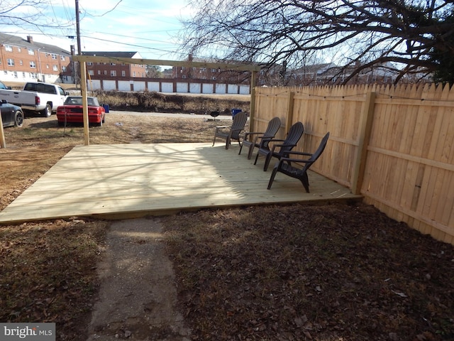 view of patio / terrace with fence and a wooden deck