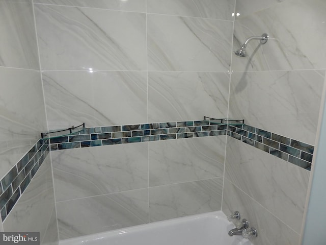 full bath featuring tub / shower combination