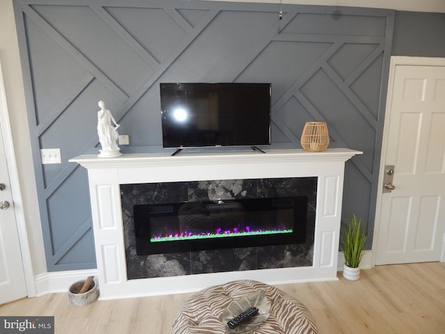 interior details featuring a fireplace and wood finished floors