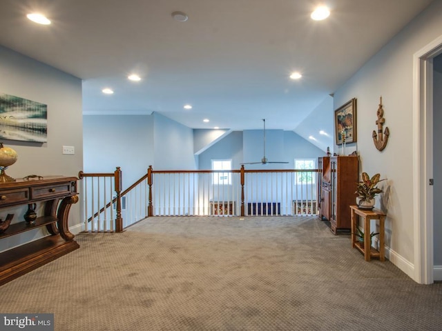 corridor with recessed lighting, carpet flooring, an upstairs landing, baseboards, and vaulted ceiling