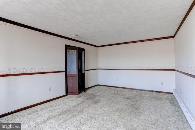 empty room featuring a textured ceiling, a baseboard radiator, baseboards, carpet, and crown molding