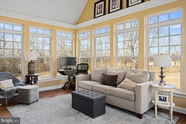 sunroom featuring lofted ceiling and plenty of natural light