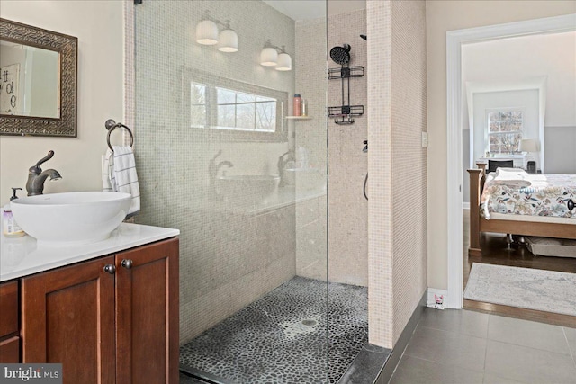 full bathroom with tile patterned flooring, a healthy amount of sunlight, ensuite bath, and walk in shower