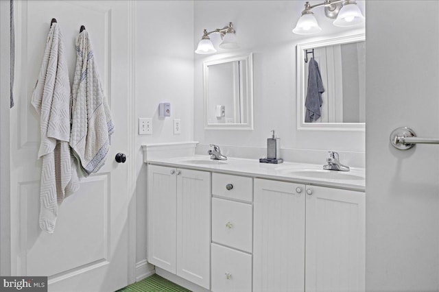 bathroom with a sink and double vanity