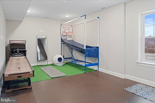 bedroom with recessed lighting, visible vents, concrete floors, and baseboards