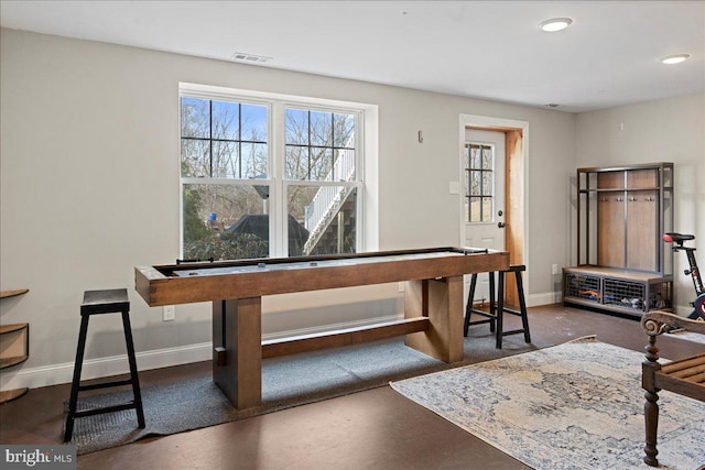 dining room with concrete flooring, recessed lighting, visible vents, and baseboards