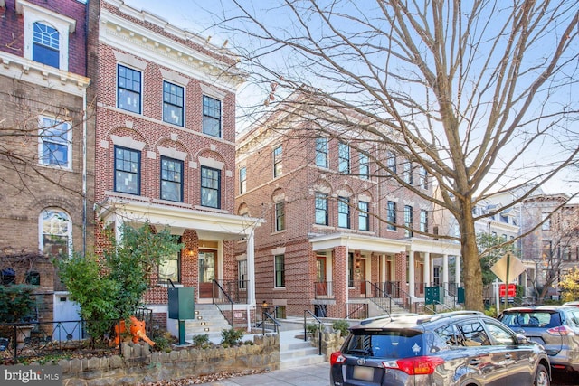 view of property with brick siding