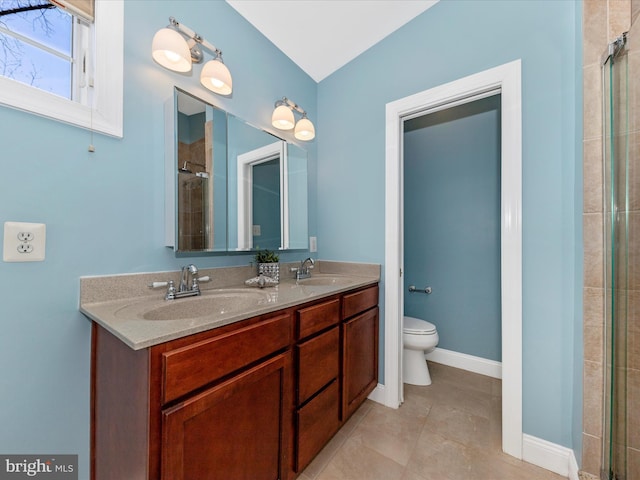 full bath featuring tile patterned flooring, toilet, baseboards, and a sink