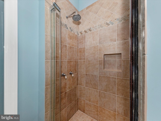 full bath with a shower stall