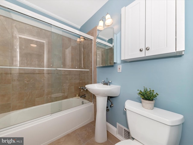 full bathroom with tile patterned flooring, visible vents, baseboards, toilet, and enclosed tub / shower combo