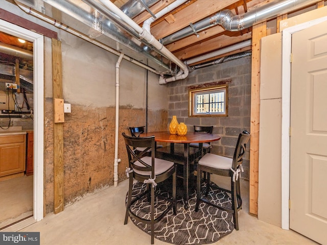 dining space featuring concrete flooring