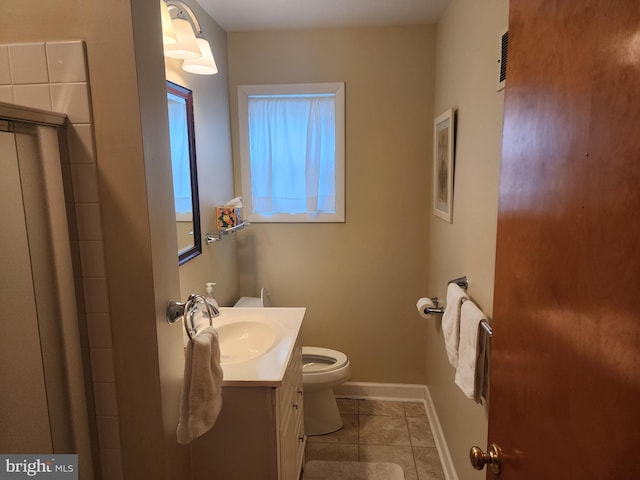 bathroom with visible vents, baseboards, toilet, tile patterned flooring, and vanity